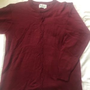 Burgundy sweater with detailing down the front